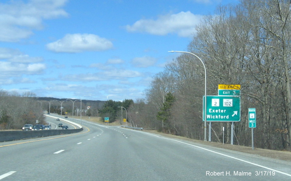 Image of new ramp sign with new exit number and old exit number tab for RI 2/RI 102 exit on RI 4 North in Exeter