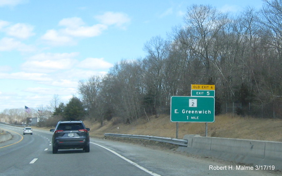 Image of new 1-mile advance sign with new exit number and old exit number tab for RI 2 exit on RI 4 North in East Greenwich