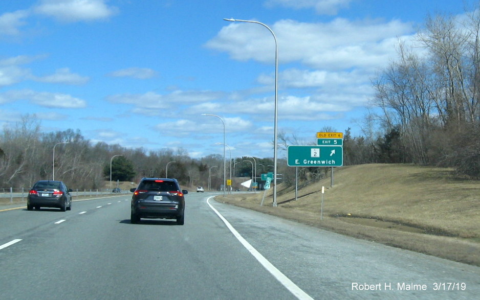 Image of new 1/2 mile advance sign with new exit number and old exit number tab for RI 2 exit on RI 4 North in East Greenwich