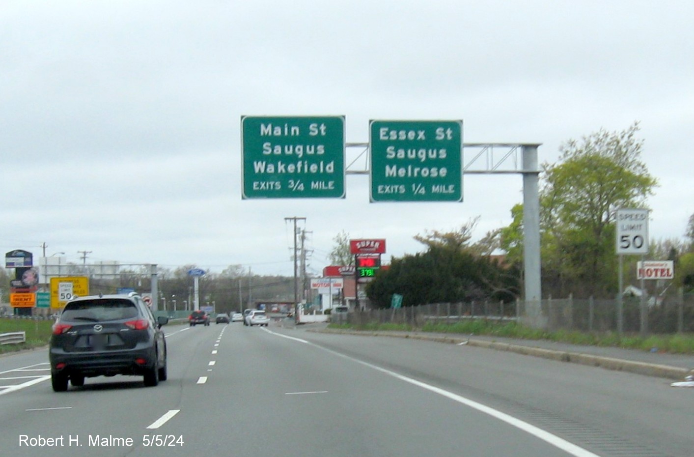 Image of overhead advance overhead signs for the Essex Street exits on US 1 North in Saugus, May 2024