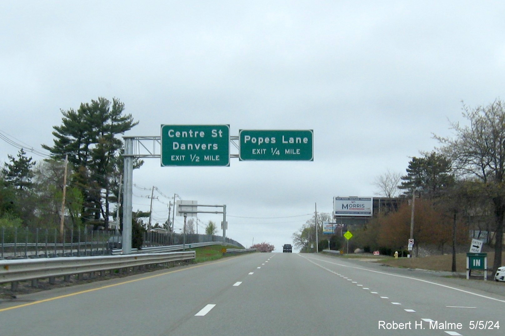 Image of recently placed 1/2 and 1/4 mile advance overhead signs for Centre Street and Popes Lane exits on 
        US 1 North in Danvers, May 2024