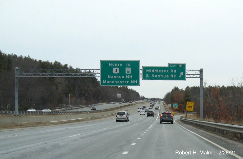 Image of overhead ramp sign for Middlesex Road exit with new milepost based exit number on US 3 North in Tyngsborough, February 2021