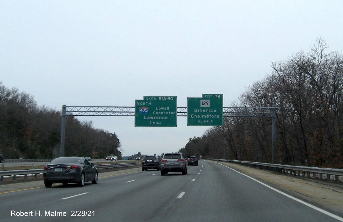 Image of 1 Mile advance overhead sign for I-495 North/Lowell Connector exits with new milepost based exit numbers on US 3 North in Chelmsford, February 2021
