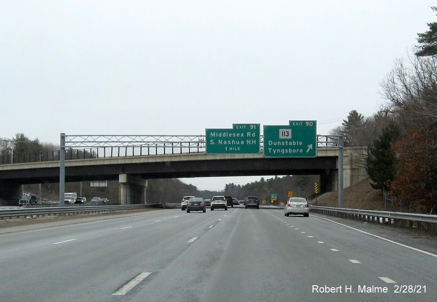 Image of overhead signage at ramp for MA 113 exit with new milepost based exit numbers on US 3 North in Tyngsborough, February 2021