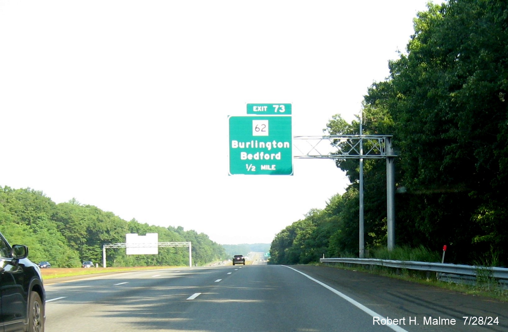 Image of recently placed 1/2 mile advance overhead sign for MA 62 exit on US 3 North in Burlington, July 2024