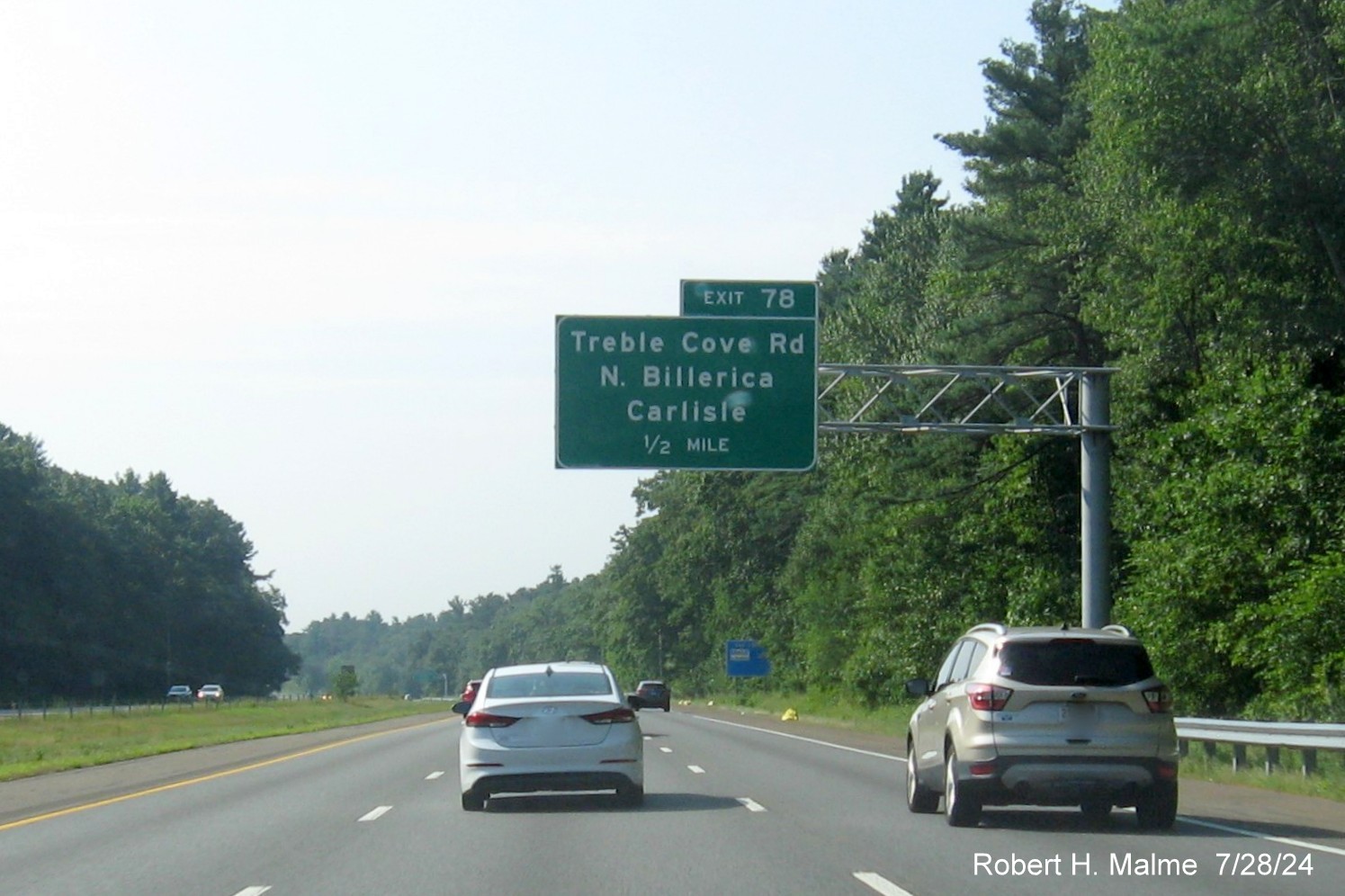 Image of recently placed 1/2 mile advance overhead sign for Treble Cove Road exit on US 3 South in Billerica, July 2024