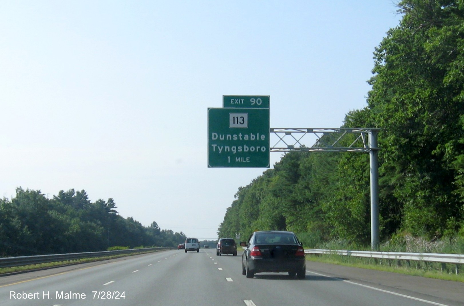 Image of recently placed 1 Mile advance overhead sign for MA 113 exit on US 3 South in Tyngsborough, July 2024