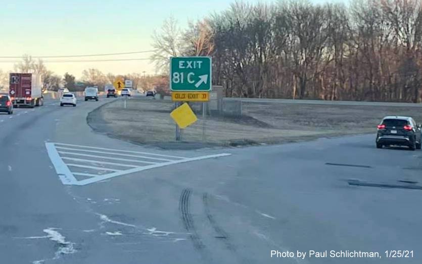 Image of gore sign for MA 110 exit with new milepost based exit numbers and yellow old exit sign below on US 3 South in Chelmsford, by Paul Schlictman, January 2021