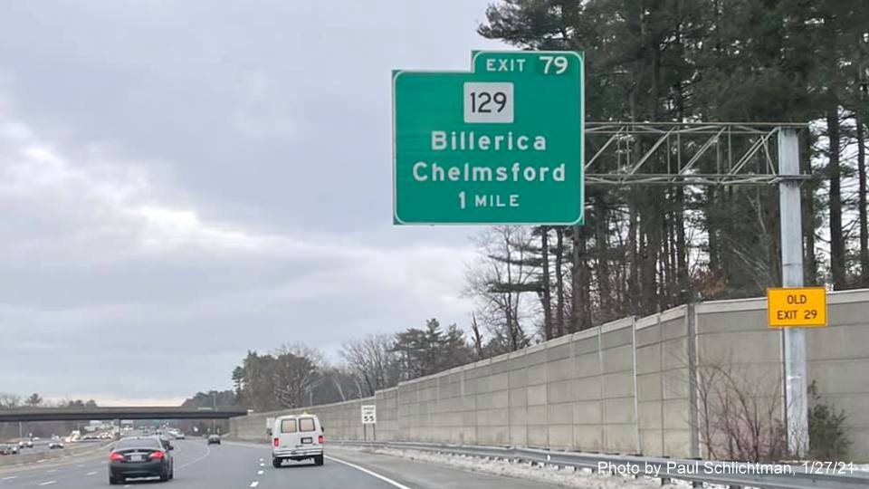 Image of 1 mile advance overhead sign for MA 129 exit with new milepost based exit number and yellow old exit number sign on support post on US 3 South in Chelmsford, by Paul Schlichtman, January 2021