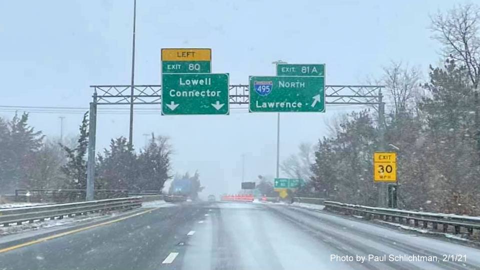 Image of overhead ramp signs for I-495 North /Lowell Connector exits with new milepost based exit numbers on ramp from US 3 North in Chelmsford, by Paul Schlichtman. February 2021