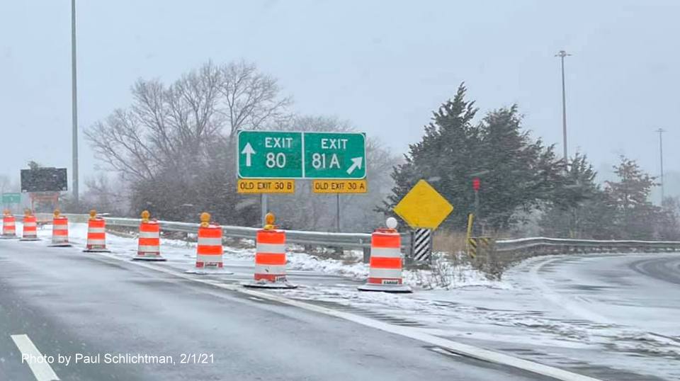 Image of gore signs for I-495 North /Lowell Connector exits with new milepost based exit numbers and yellow old exit number signs below on ramp from US 3 North in Chelmsford, by Paul Schlichtman. February 2021