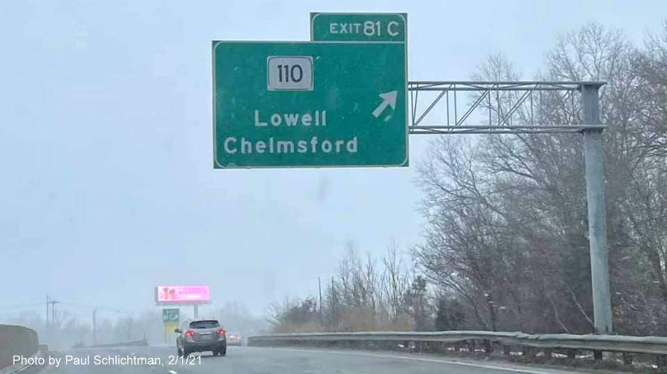 Image of overhead ramp sign for MA 110 exit with new milepost based exit number on US 3 North in Chelmsford, by Paul Schlichtman. February 2021