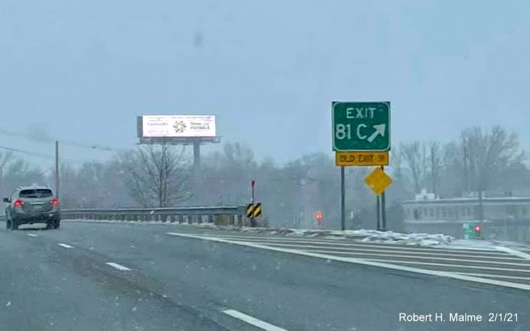 Image of gore sign for MA 110 exit with new milepost based exit number and yellow old exit number sign below on US 3 North in Chelmsford, by Paul Schlichtman. February 2021