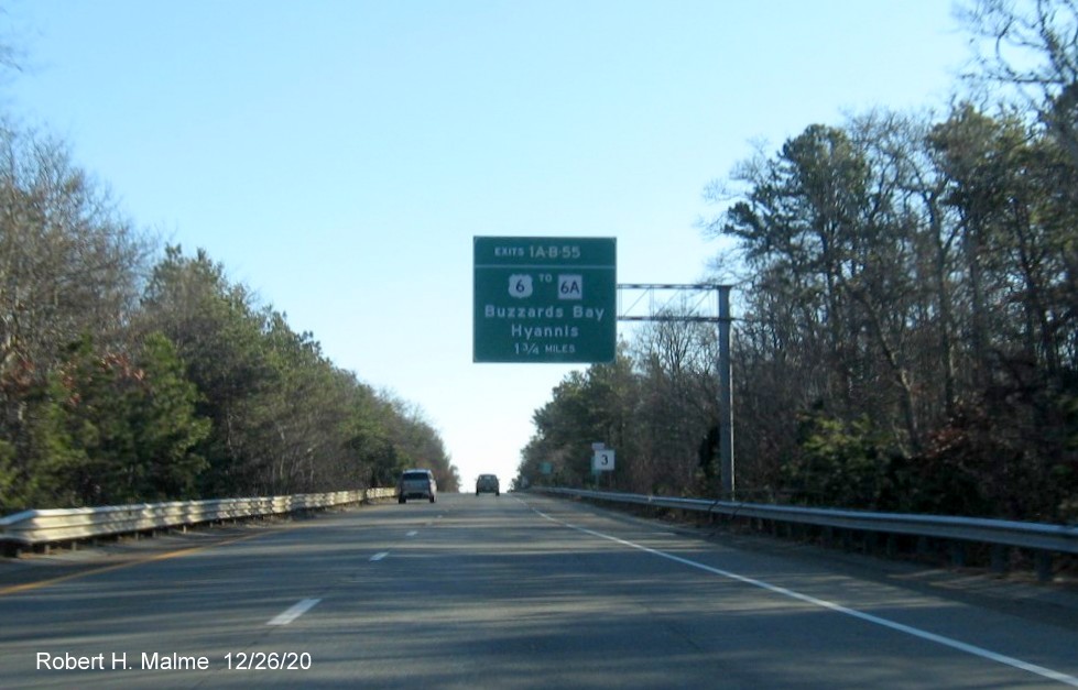 Image of 1 3/4 miles advance overhead sign with new milepost based exit number for MA 6A exit on MA 3 South in Bourne, December 2020
