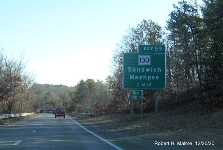 Image of 1 mile advance sign for MA 130 exit with new milepost based exit number and green old exit number sign placed in front on US 6 East in Sandwich, December 2020