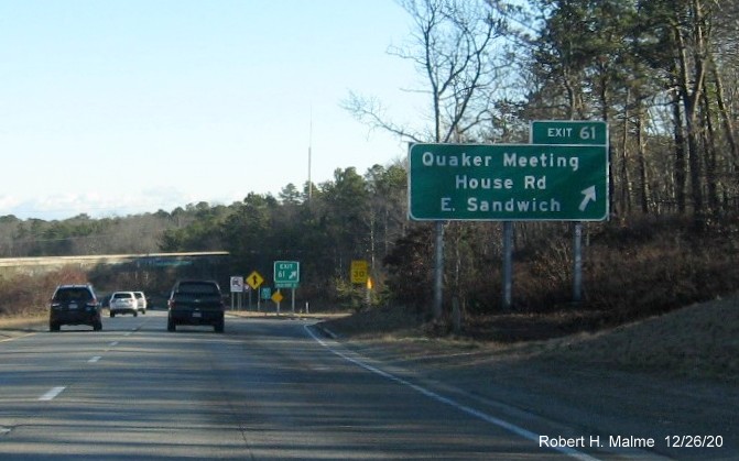 Image of ground mounted ramp sign for Quaker Meeting House Road exit with new milepost based exit number and gore sign with green old exit number below on US 6 East in Sandwich, December 2020