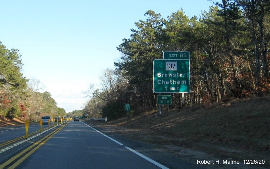 Image of 1-mile advance sign for MA 137 exit with new milepost based exit number and green old exit sign on left support post on US 6 East in Brewster, December 2020