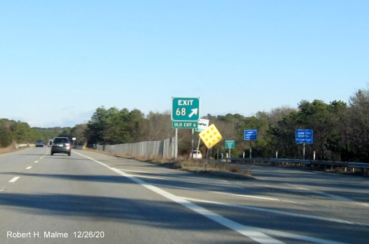 Image of gore sign for MA 132 exit with new milepost based exit number and green old exit number sign below on US 6 East in Barnstable, December 2020