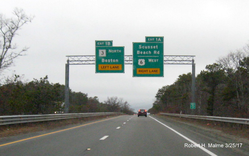 Image of overhead signs for MA 3 and Scusset Rd exits on US 6 West in Bourne