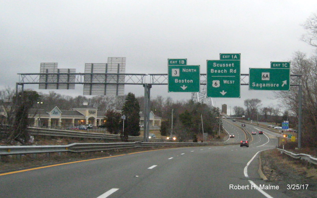 Image of overhead exit signs for MA 3, MA 6A and Scusset Rd on US 6 West in Bourne