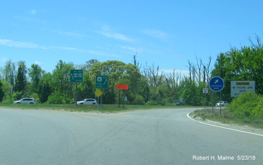 Image of guide signs for US 6 West, MA 28 North and MA 6A West in Orleans Rotary at beginning of Mid-Cape Highway
