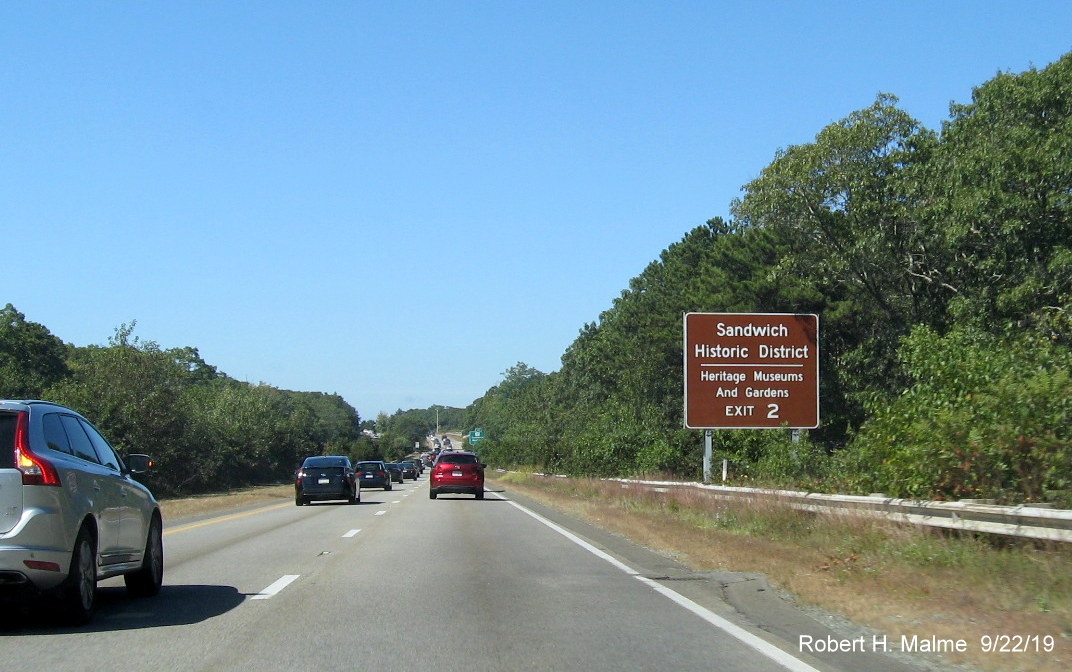 Image of recently placed brown attractions sign prior to Quaker Meeting House Road exit on US 6 West in Sandwich