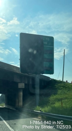 Image of newly placed and 1/2 covered digital travel time sign prior to the split of I-85 South 
          and I-40 West, photo by Strider, July 2023