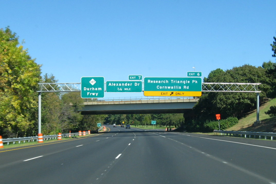 Image of overhead exits signs on the Durham Freeway North for Alexander Drive and Cornwallis 
Road, taken Oct. 2011