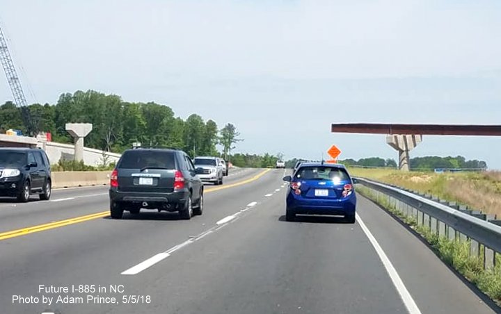 Image of US 70 West traffic approaching incomplete flyover ramp to Future I-885 South in East End Connector project work zone in Durham, by Adam Prince