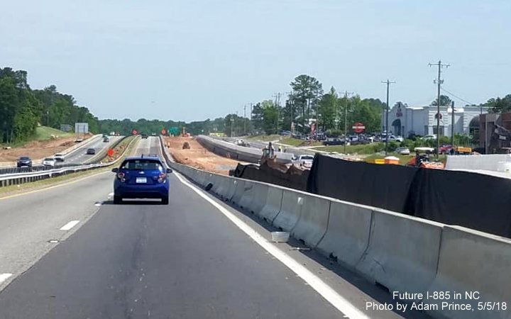 Image of traffic on US 70 West beyond NC 98 interchange showing progress building new freeway as part of East End Connector/Future I-885 project in Durham, by Adam Prince