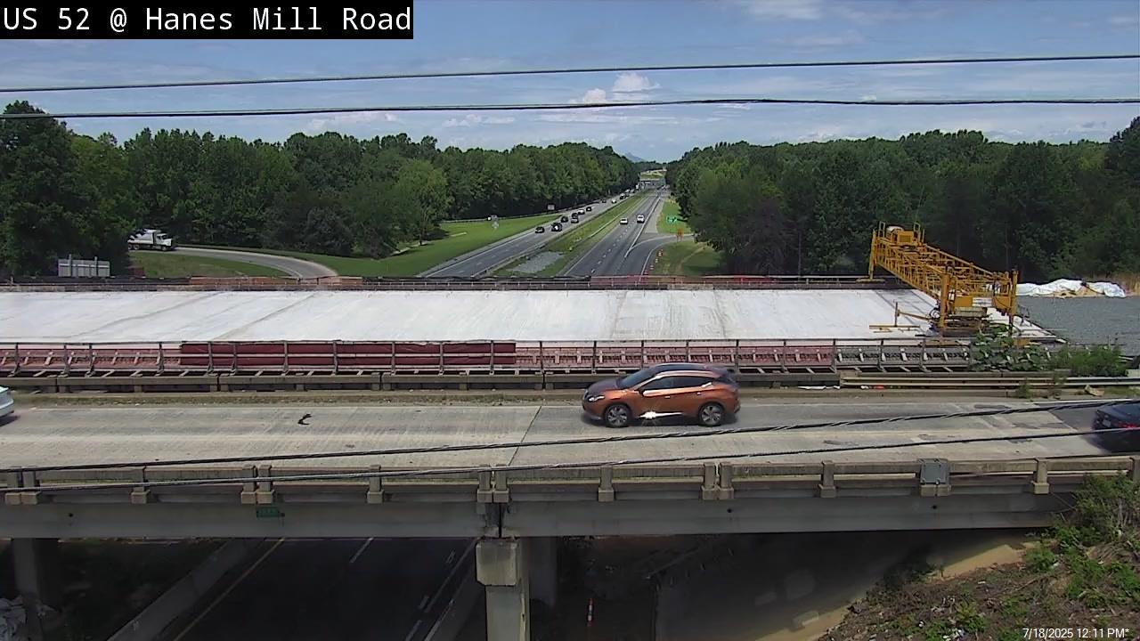 Image of new Hanes Mill Road bridge being constructed over US 52 
	 (Future I-285) by NCDOT traffic camera, July 2025
