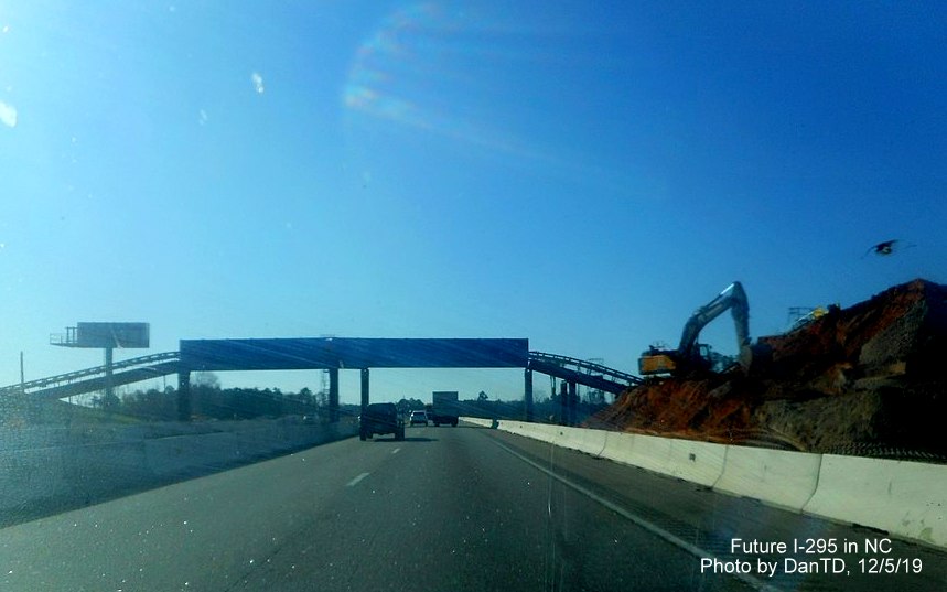 Image of conveyor belt system over I-95 South lanes to carry excavated 
      material from Future I-295 interchange over highway, in Wikimedia by DanTD