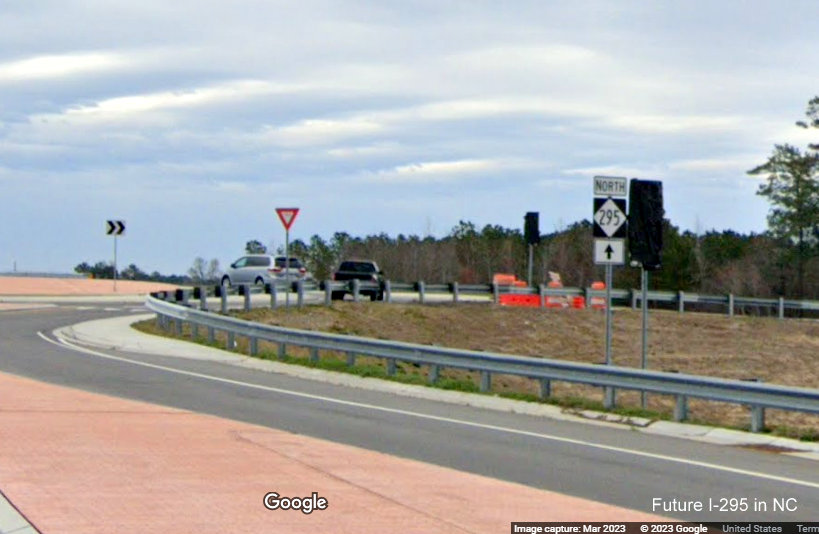 Image of uncovered and covered NC 295 trailblazers along Parkton Road at southern end of newly 
        opened section to Black Bridge Road, Google Maps Street View, March 2023