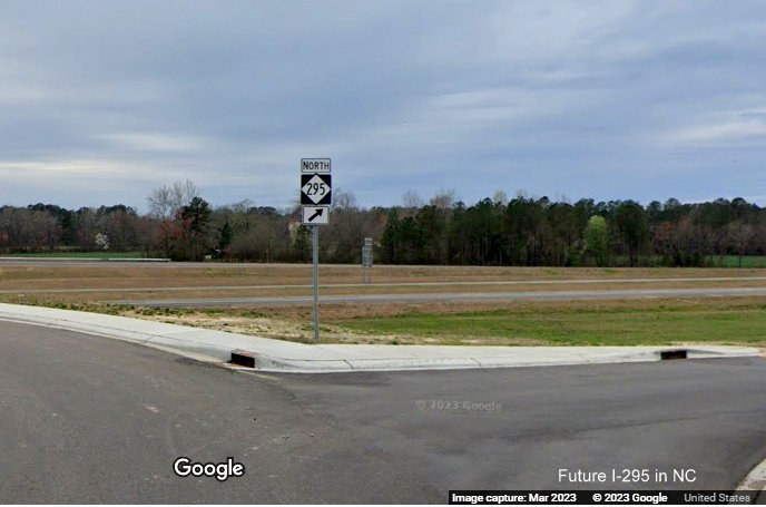 Image of North NC 295 trailblazer at northbound on-ramp from Parkton Road to 
        opened section of Fayetteville Outer Loop to Black Bridge Road, Google Maps Street View, March 2023