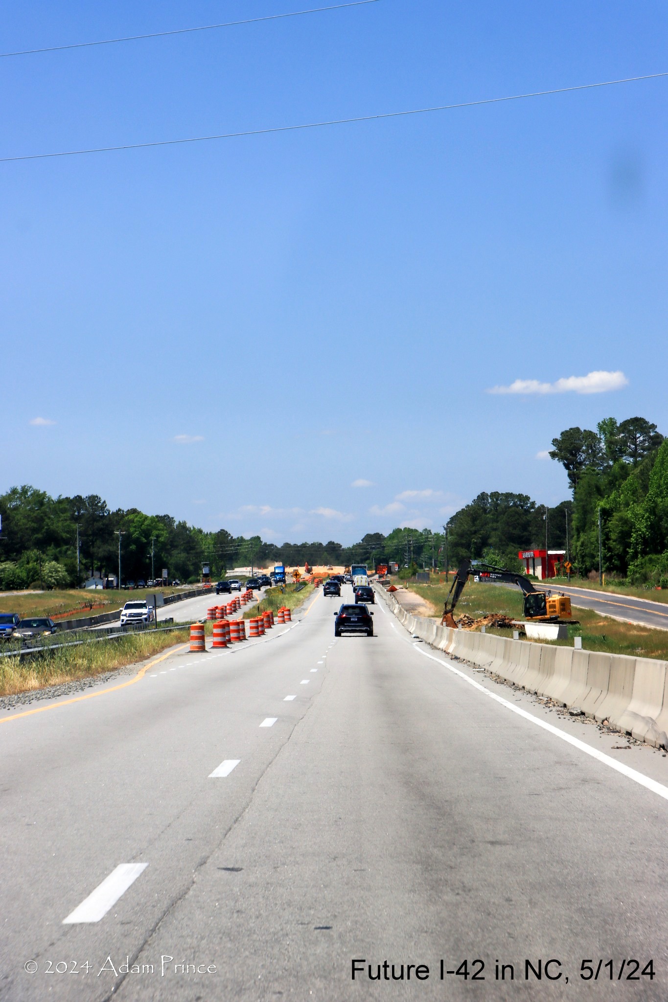 Image of construction zone along US 70 (Future I-42) West approaching Wilson's Mills Road, by Adam Prince, May 2024