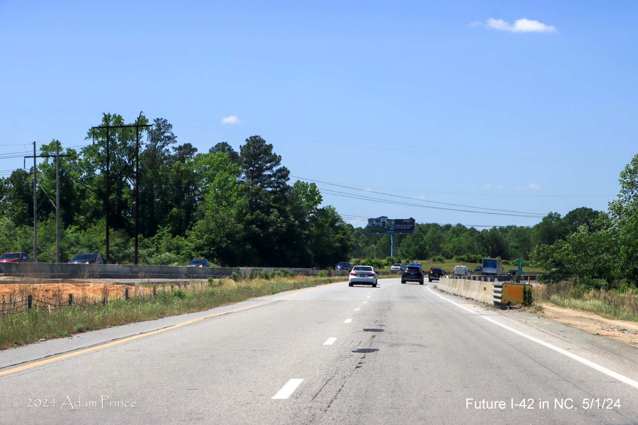 Image of US 70 (Future I-42) West lanes between the Wilson's Mills Road and Swift Creek Road 
        intersections, by Adam Prince, May 2024