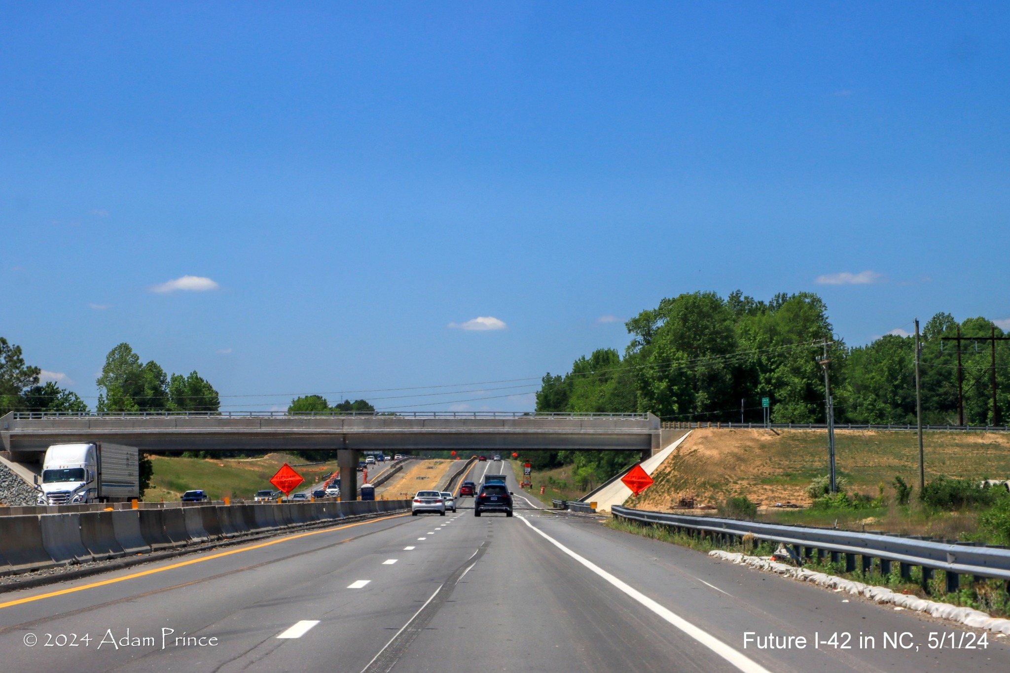 Image of new Swift Creek Road bridge over US 70 (Future I-42) West in Wilson's Mills, 
        by Adam Prince, May 2024