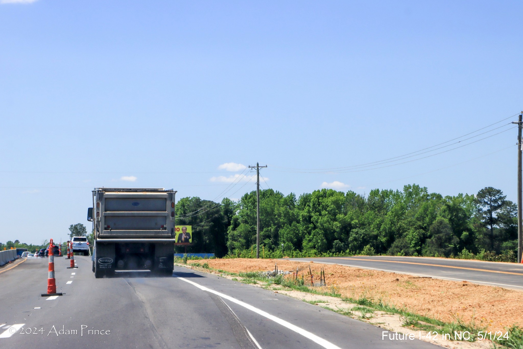 Image of median construction along US 70 (Future I-42) West approaching the Clayton Bypass, 
        by Adam Prince, May 2024