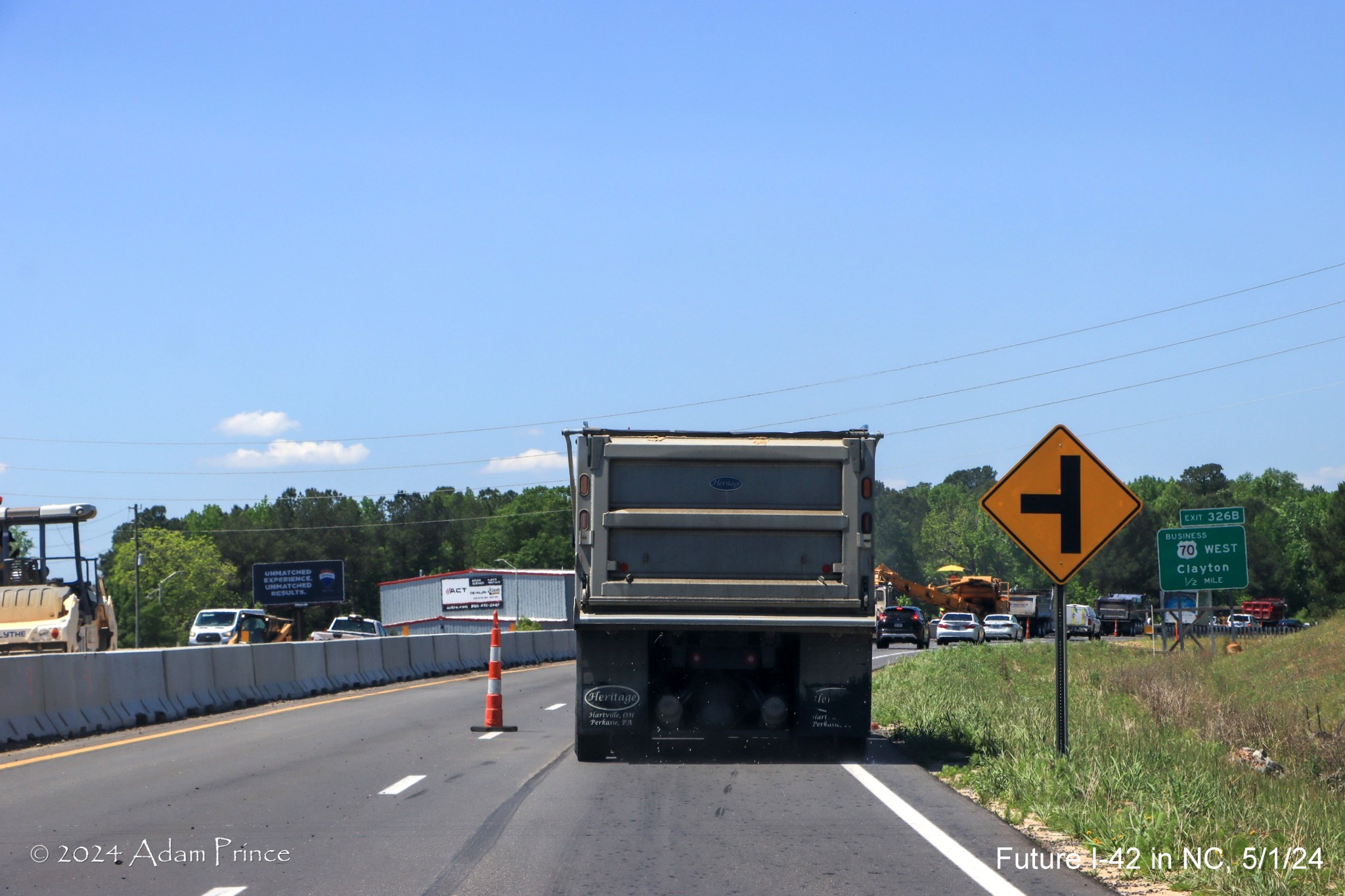 Image of cross street sign on US 70 (Future I-42) West for Sadisco Road now closed approaching the Clayton Bypass, 
        by Adam Prince, May 2024