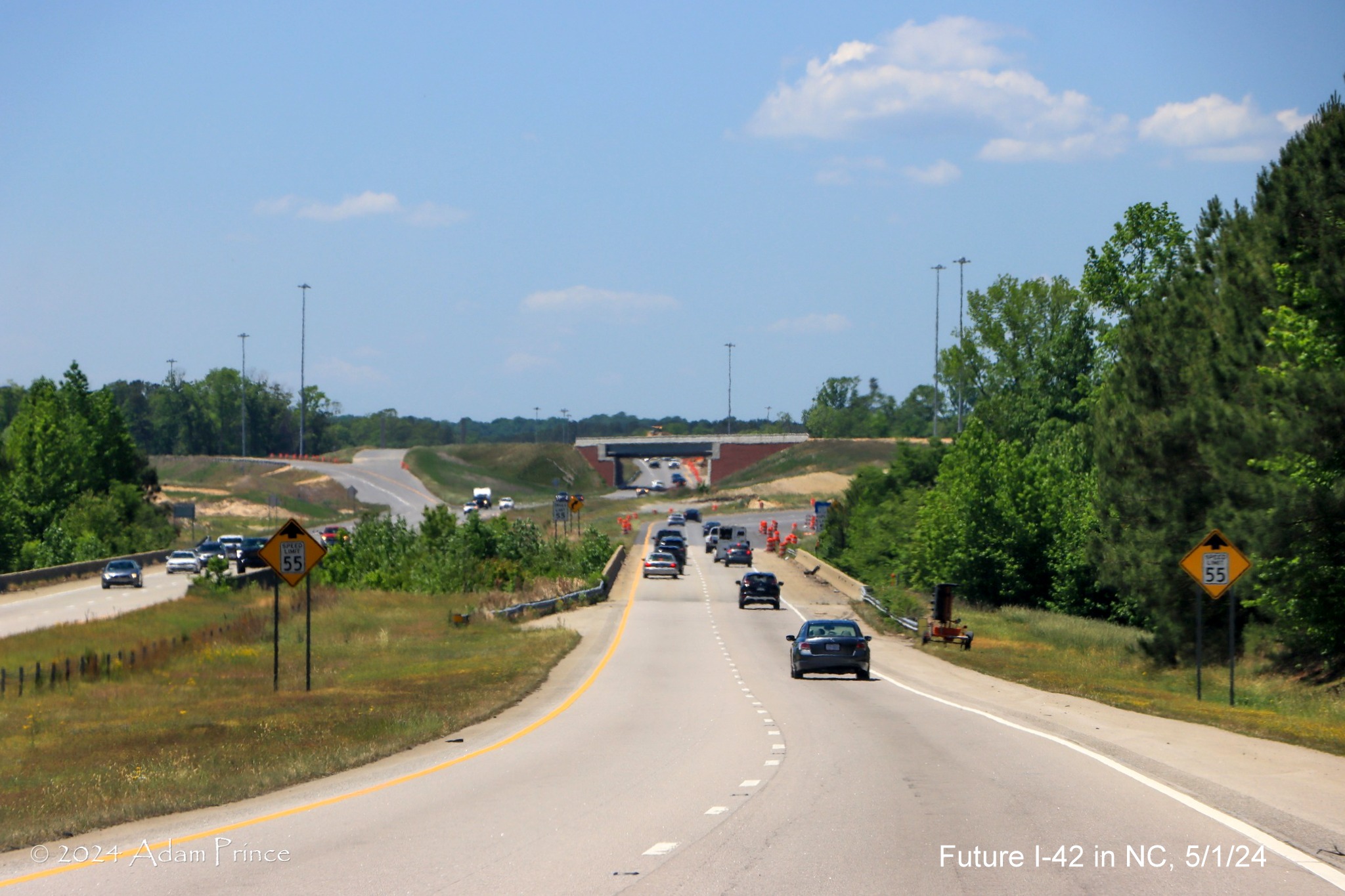 Image of lanes on US 70 (Future I-42) West approaching the I-40/NC 540 turbine interchange, by Adam Prince, May 2024