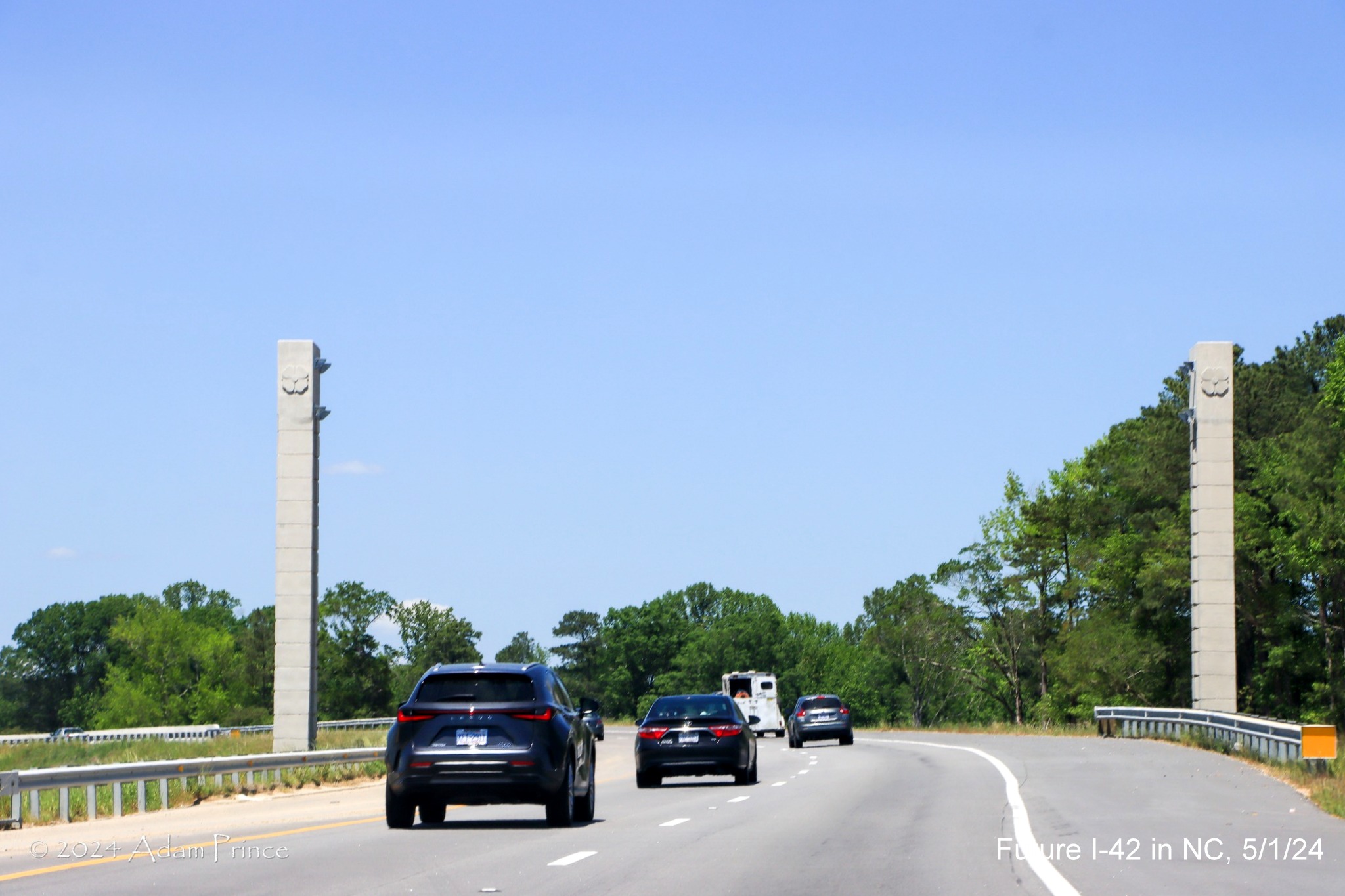 Image of US 70 (Future I-42) West lanes approach future sign gantry at the I-40/NC 540 turbine interchange ramps, 
       by Adam Prince, May 2024