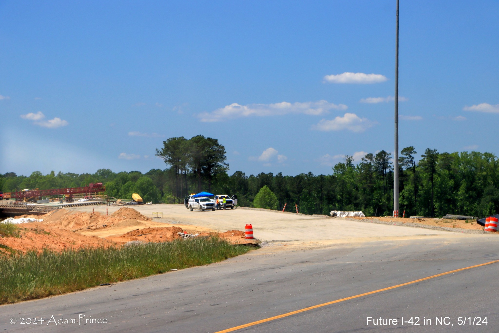 Image of future ramp to I-40 East, NC 540 West from US 70 (Future I-42) West lanes in the 
         I-40/NC 540 turbine interchange ramps, by Adam Prince, May 2024