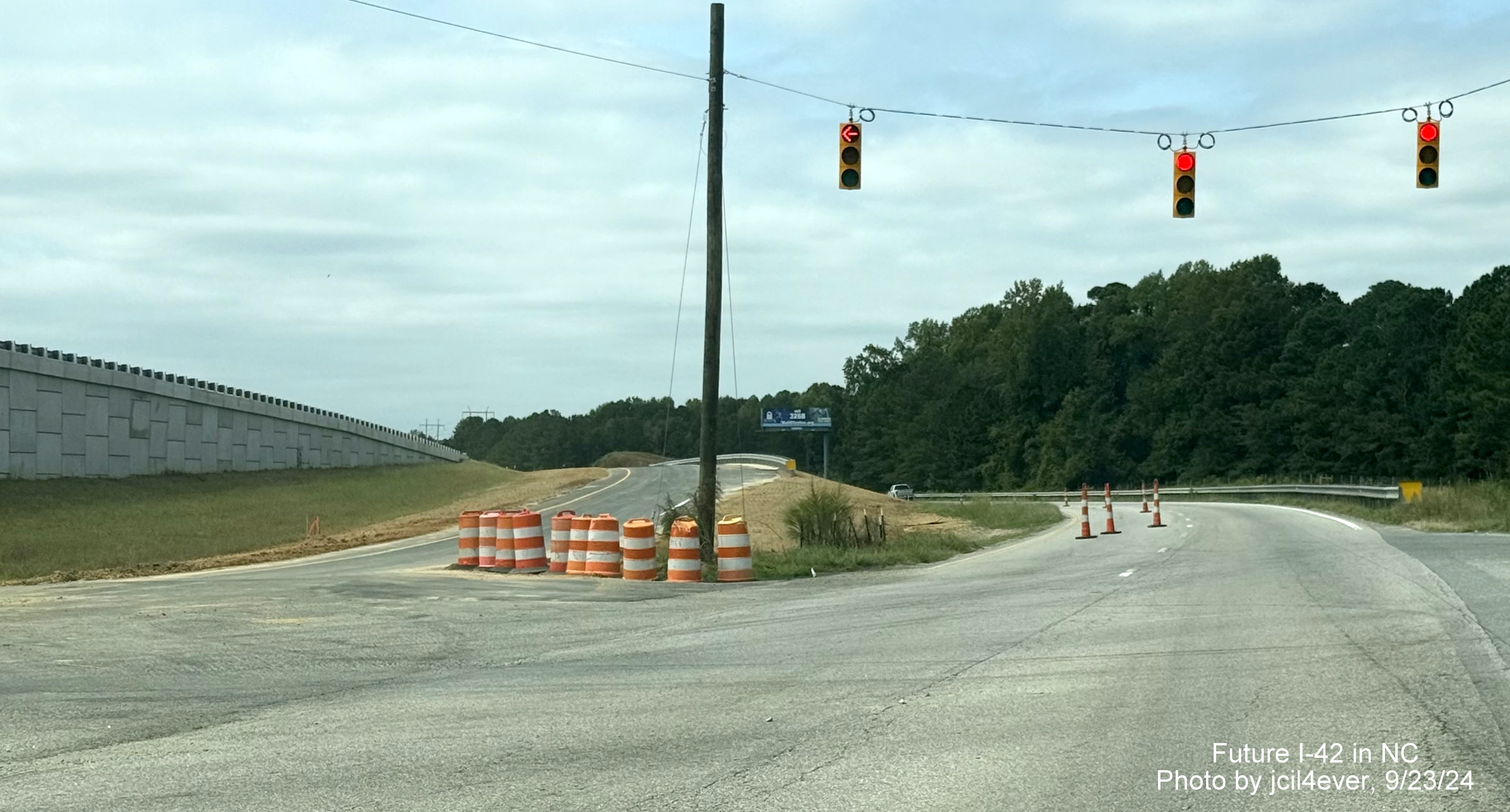 Image of traffic light at current Wilson's Mills Road intersection with US 70 West in Johnston 
     County, by jcil4ever, September 2024