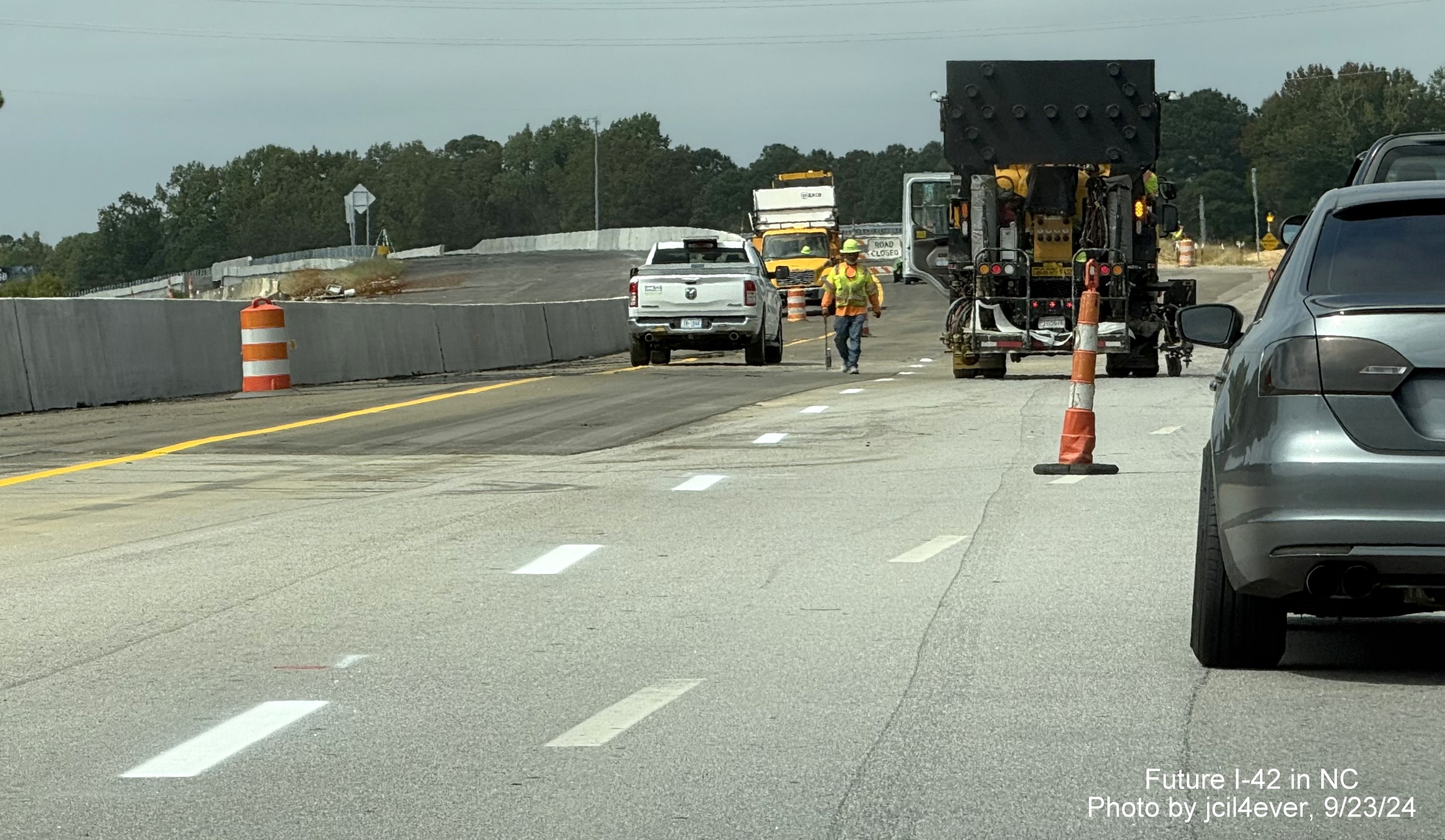 Image of line painting occuring along the soon to open Wilson's Mills Road interchange 
     from US 70 (Future I-42) West in Johnston County, by jcil4ever, September 2024