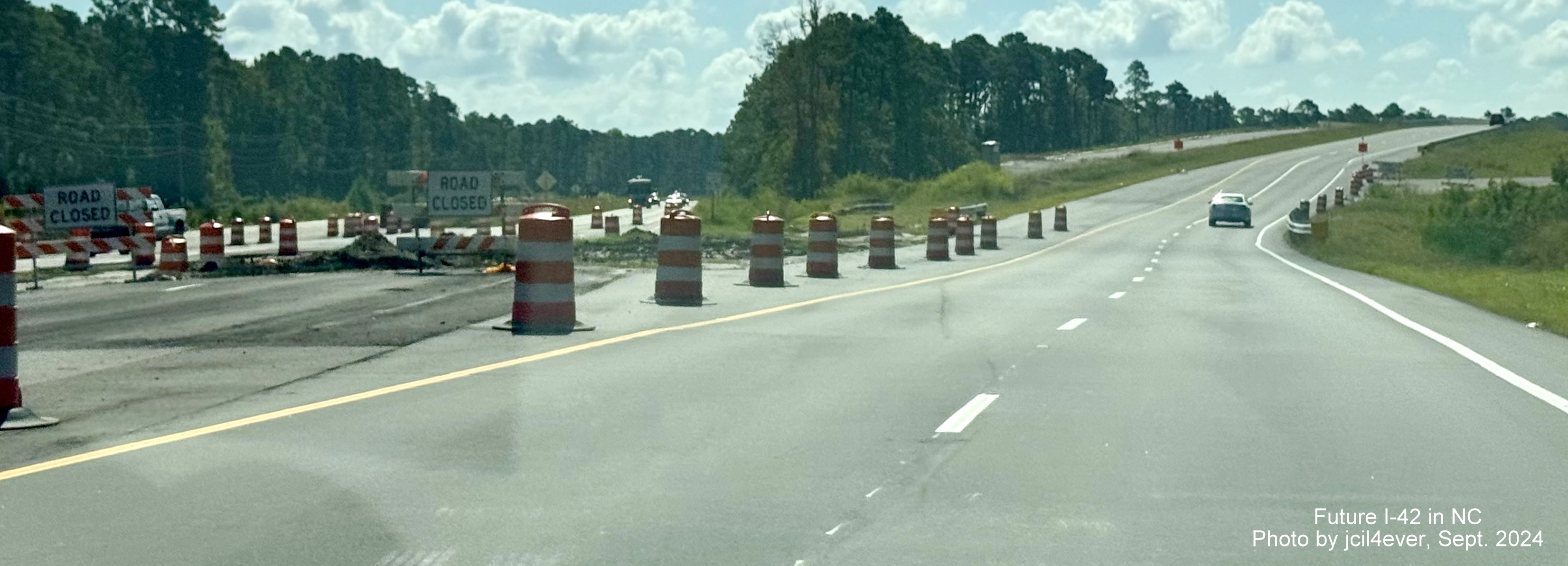 Image of new alignment of US 70 East heading towards bridge over Havelock Bypass at its eastern end, by jcil4ever, September 2024