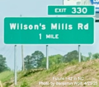 Image of new 1 mile advance sign on US 70 (Future I-42) West for
the Wilson's Mills Road interchange in Johnston County, by Benjamin Wolf, April 2025