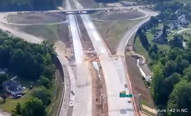 Screen grab image from Buckeye Drones video of new overhead signage with I-40 and US 70 shields on Future NC 540 East at NC 50 interchange, July 2024