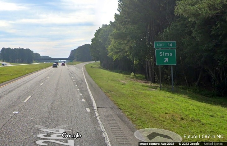 Image of ground mounted exit sign for Sims exit with new I-587 milepost exit number on US 264 East in Sims, Google Street View image, August 2022