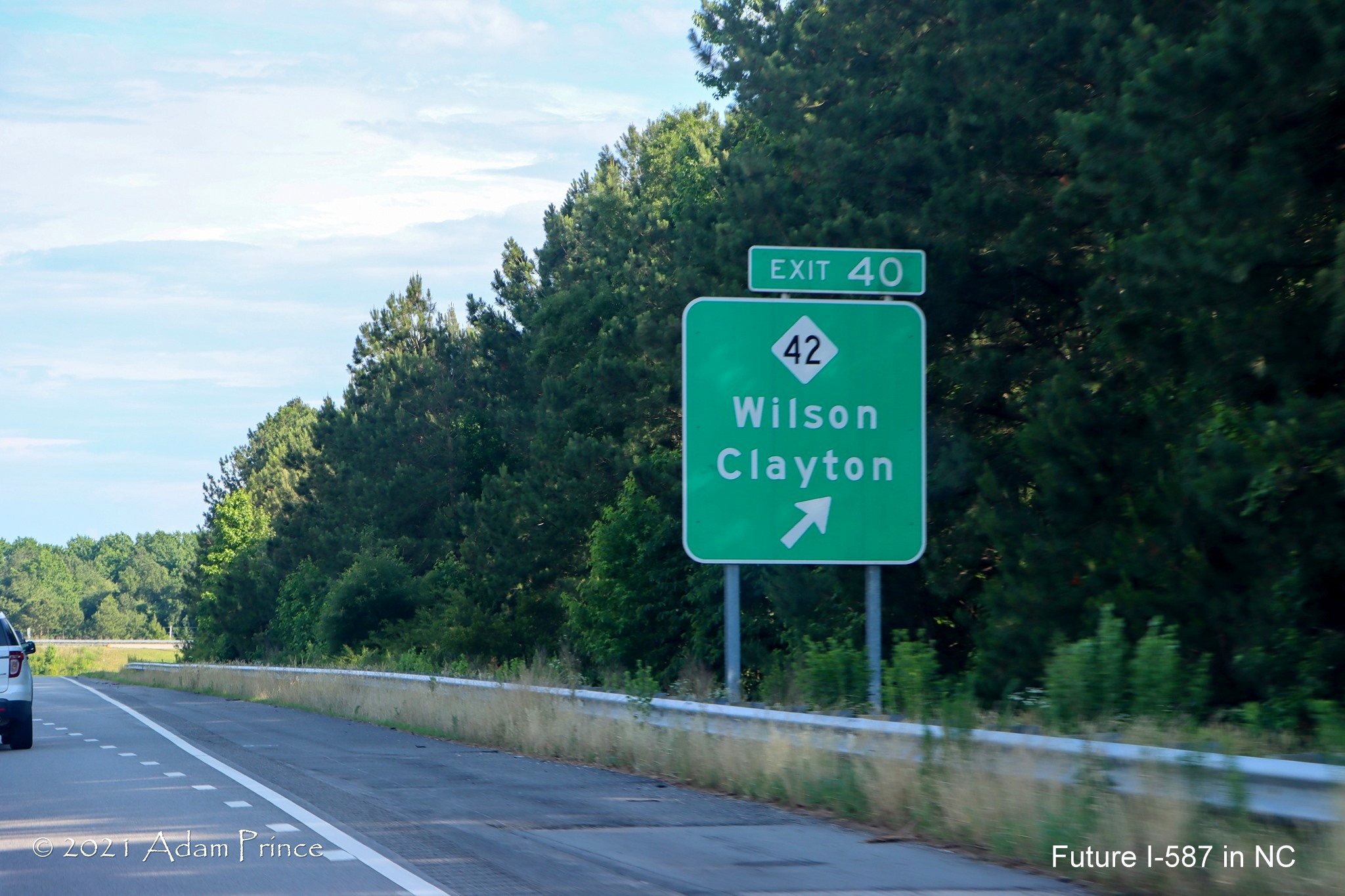 Ground mounted ramp sign for NC 42 exit on US 264 East (Future I-587 South) in Wilson, photo by Adam Prince, June 2021