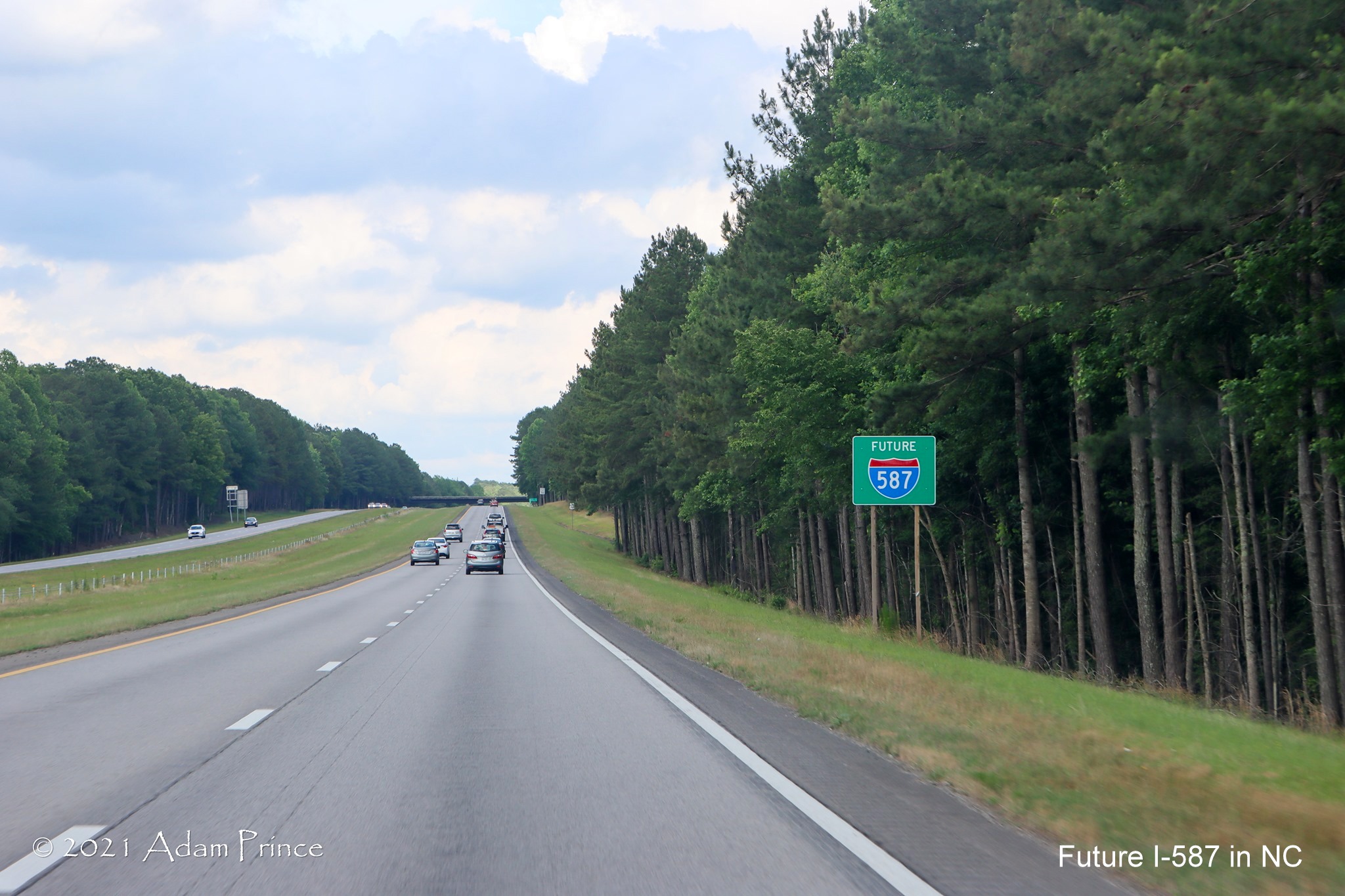 Image of Future I-587 sign at county line on US 264 East, photo by Adam Prince, June 2021